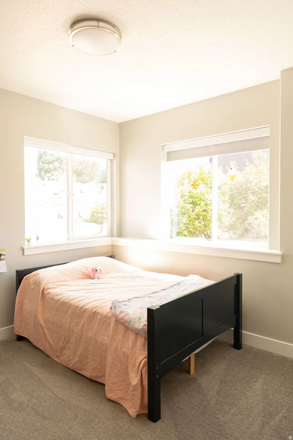 Recessed lighting fixture, light gray wall paint, and white trim