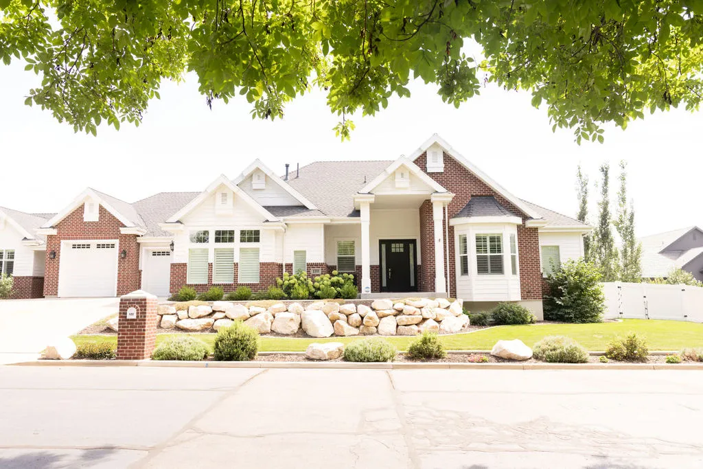 Brick and siding exterior with a prominent front entrance
