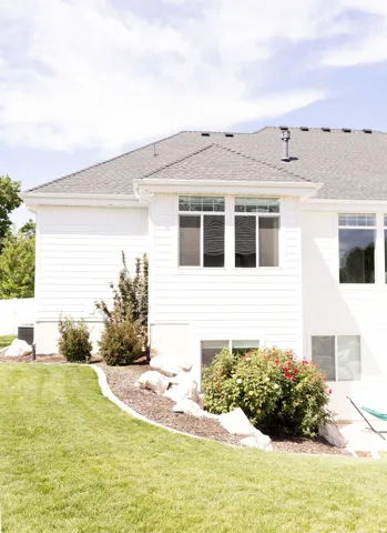White siding exterior with multiple windows