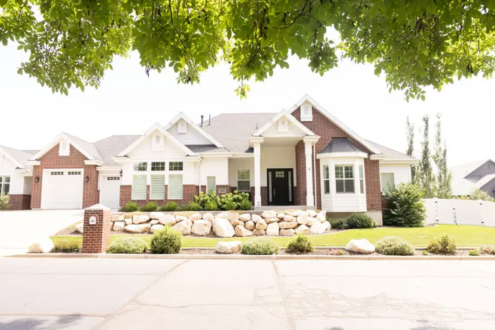 Brick and siding exterior with a prominent front entrance