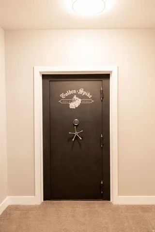 Secure vault door with combination lock and five-spoke handle