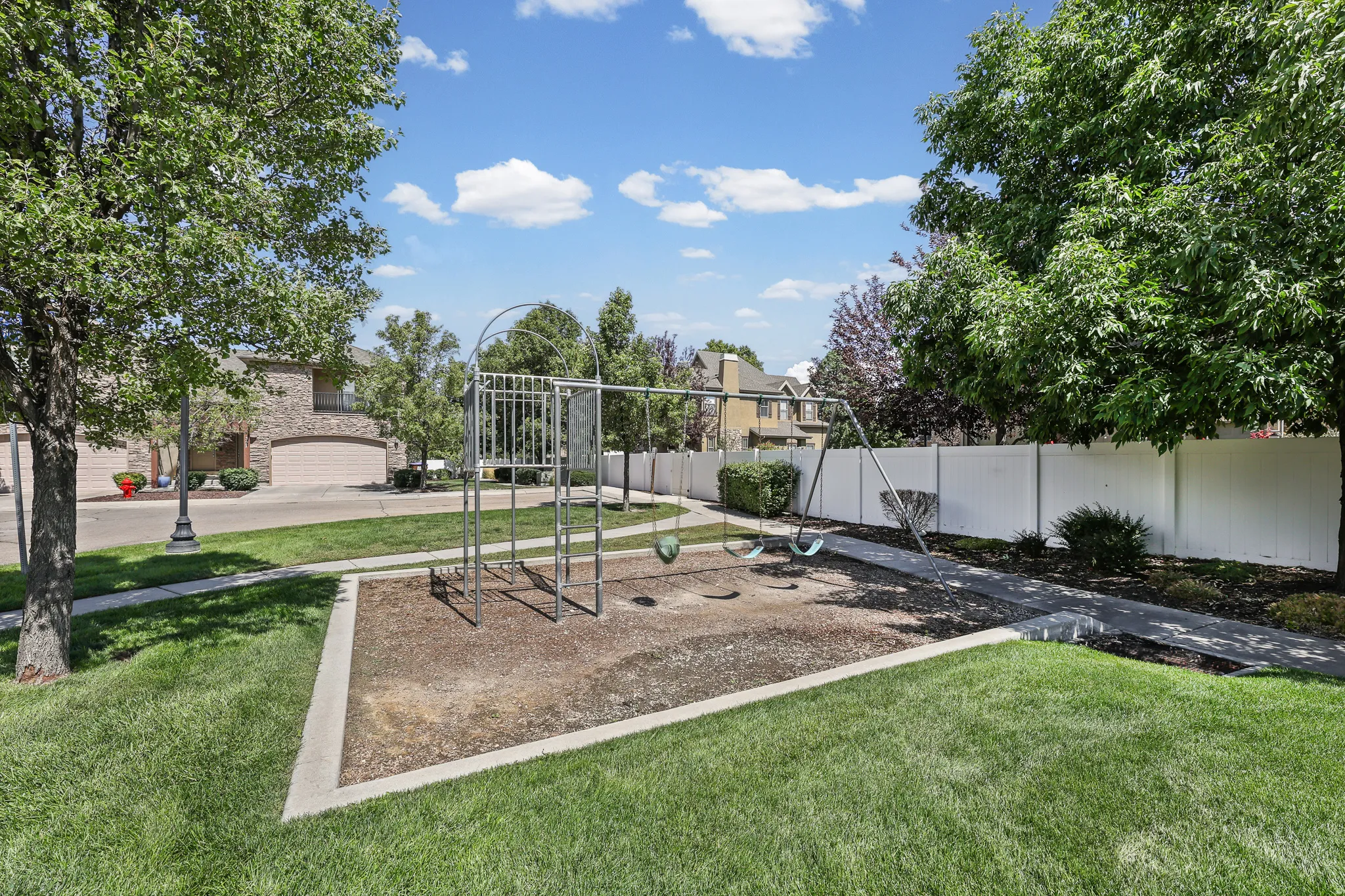 Community Grassy area with Playground and picnic tables