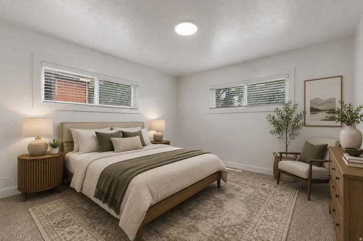 Virtually staged. Carpeted flooring, white walls, and a flush-mount ceiling light