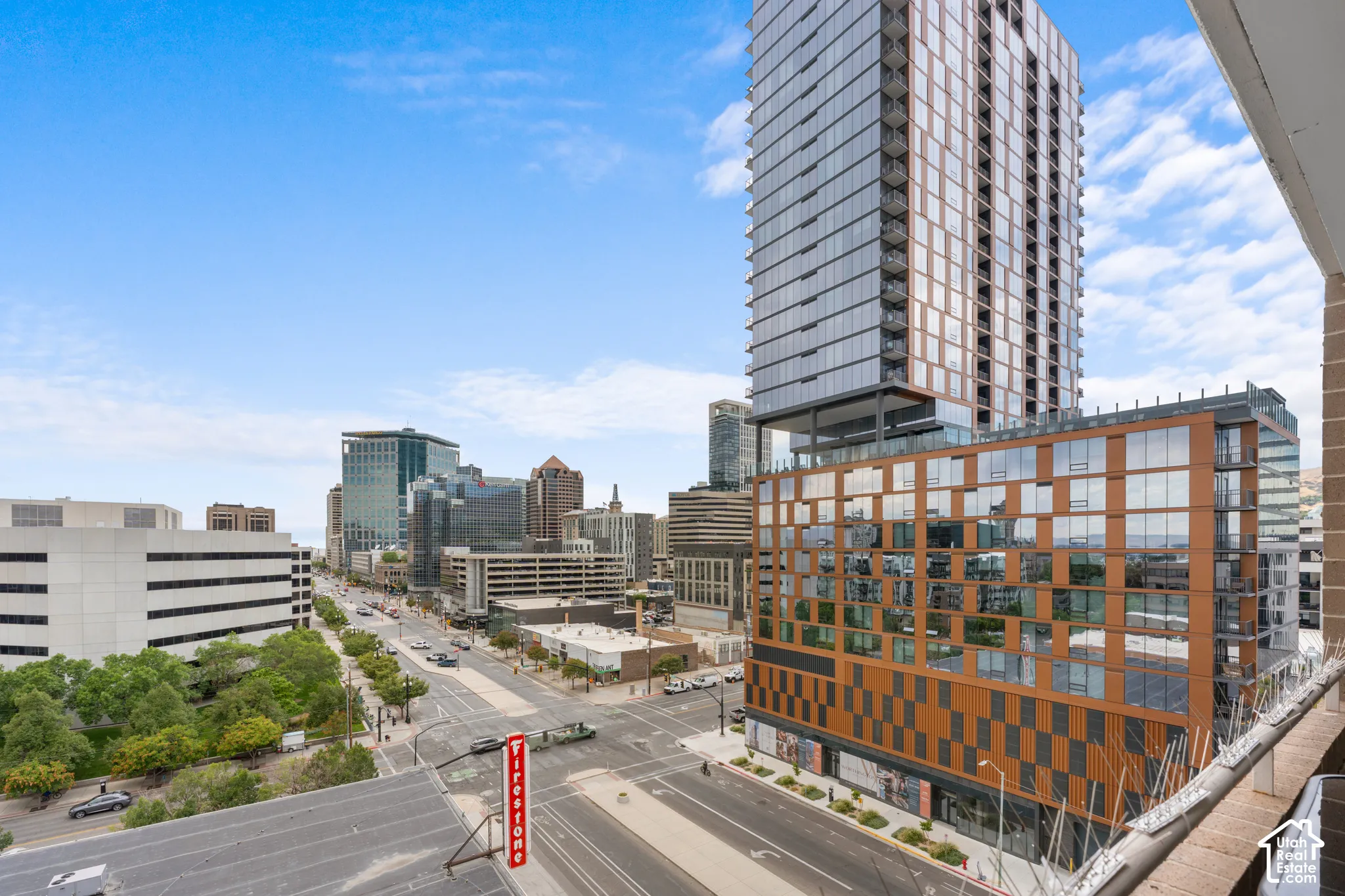 Cityscape featuring multiple high-rise buildings and street-level activity
