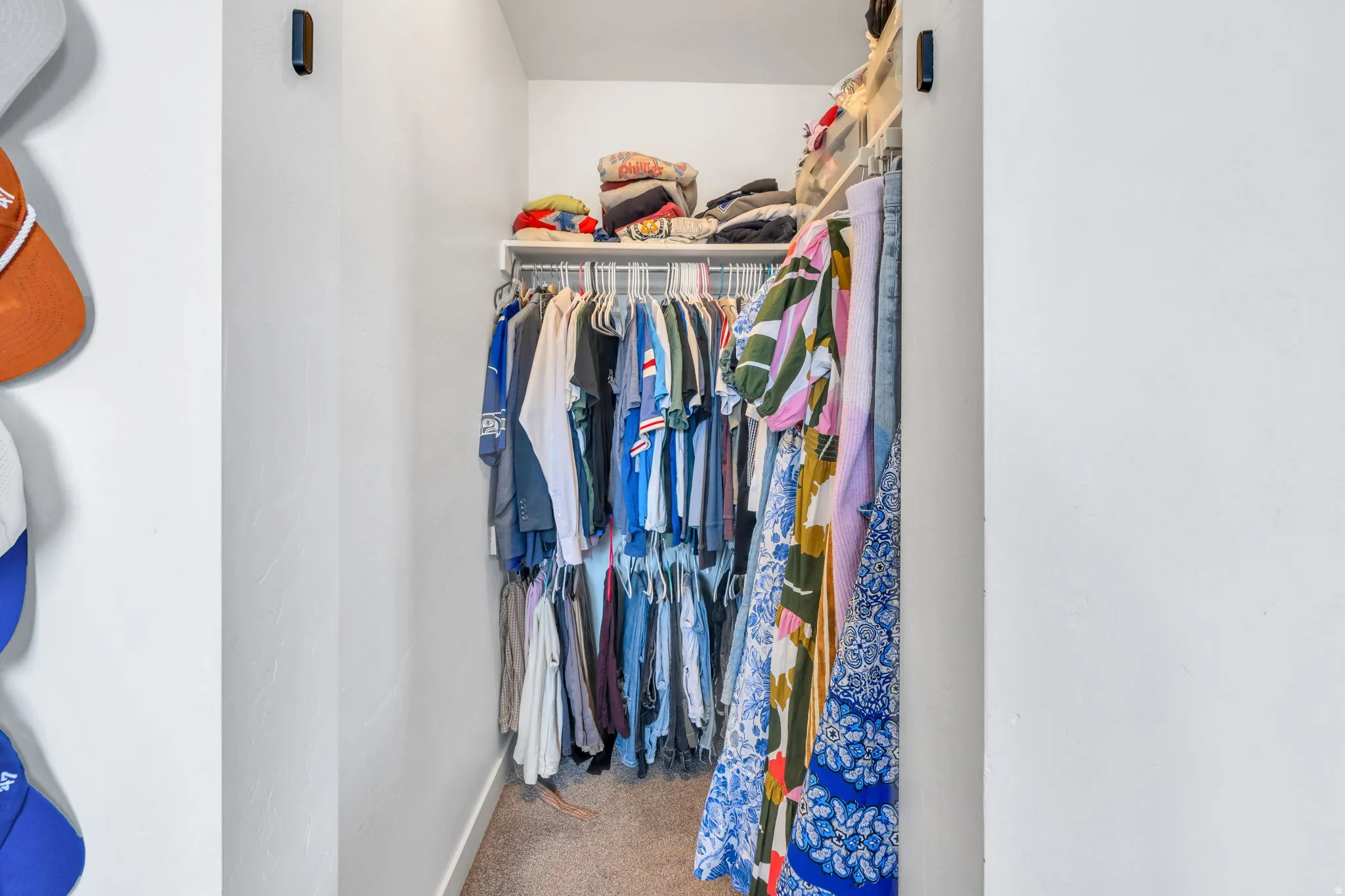 Built-in closet system with wire shelving and hanging rods