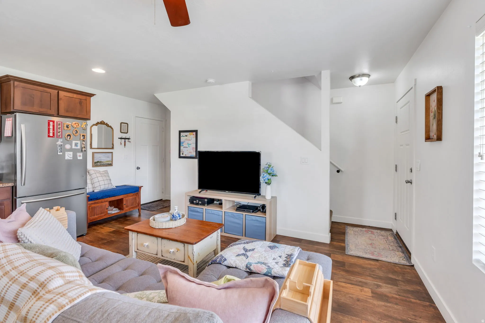 Wood-finish flooring, recessed lighting, and a neutral color palette