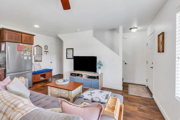Wood-finish flooring, recessed lighting, and a neutral color palette