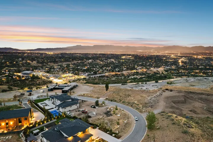 Expansive elevated setting with surrounding residential areas and distant mountain ranges