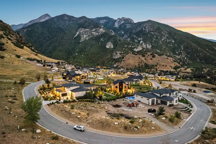 Mountain-side community featuring modern architecture and a paved road system