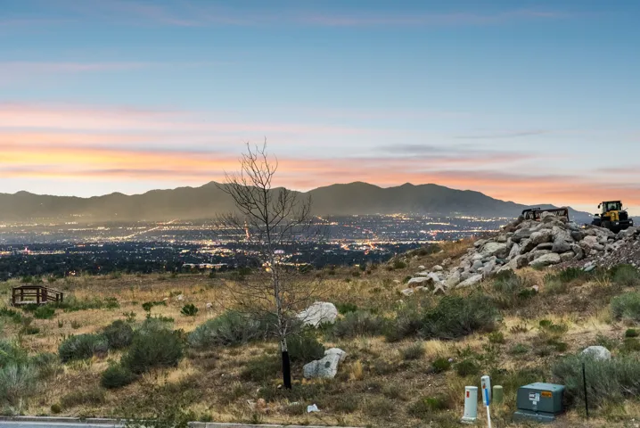 City lights in the distance with a mountain backdrop