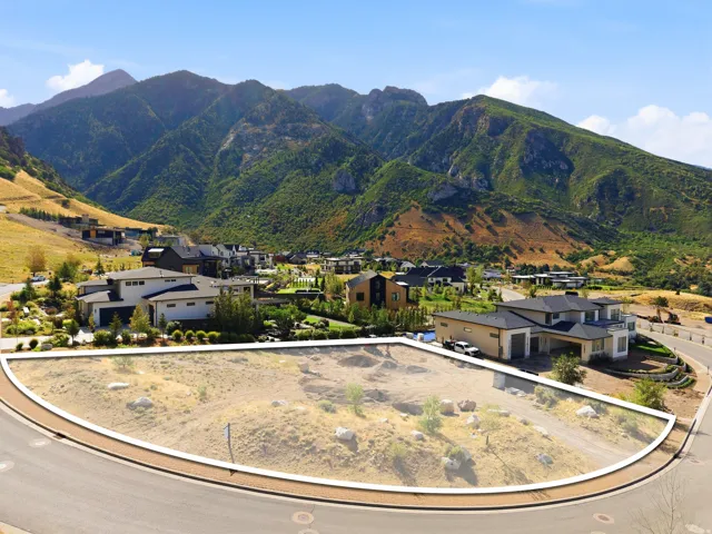 Curved lot with mountain backdrop and established surrounding properties