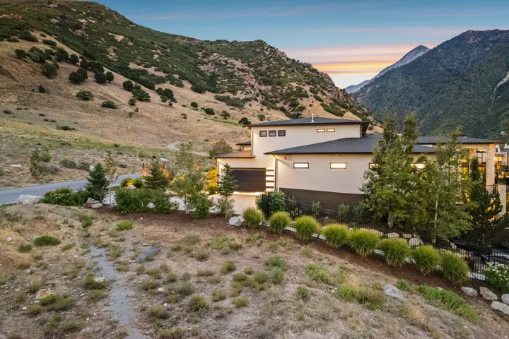 Contemporary exterior with a flat roof, large windows, and a multi-level design