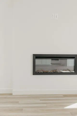 Integrated linear fireplace with wood-finish flooring
