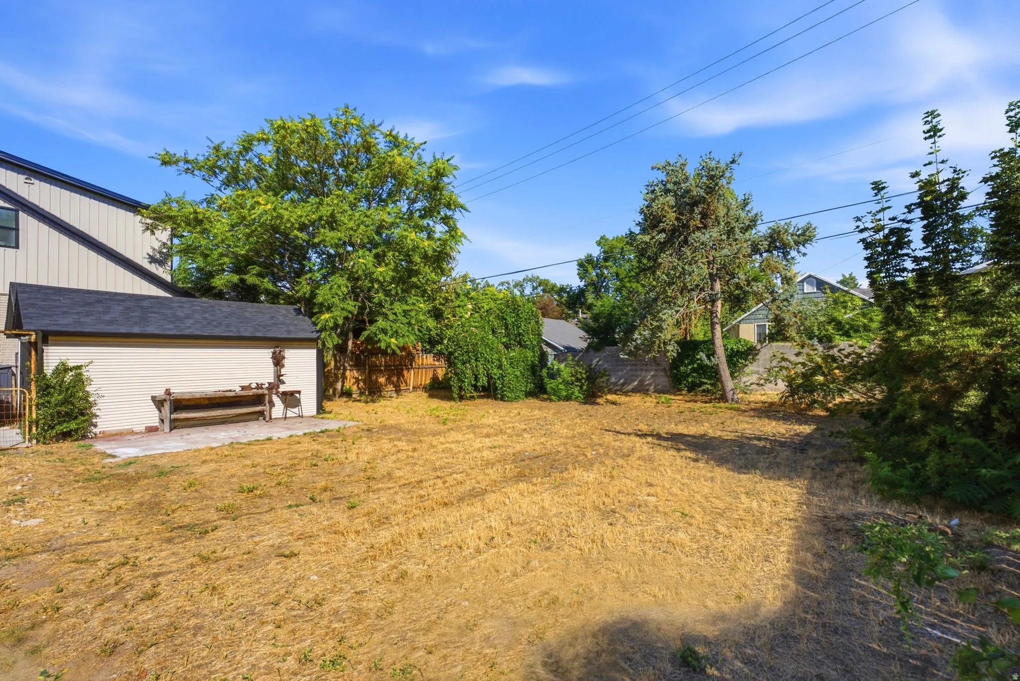 Detached shed with asphalt shingle roof