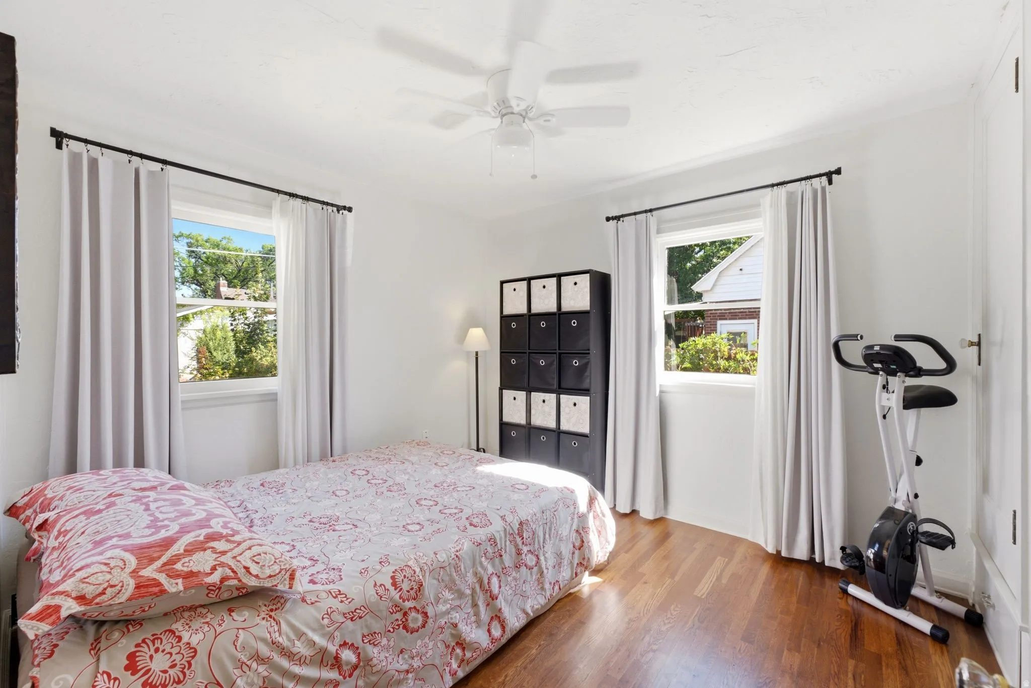 Hardwood flooring and dual windows with natural light