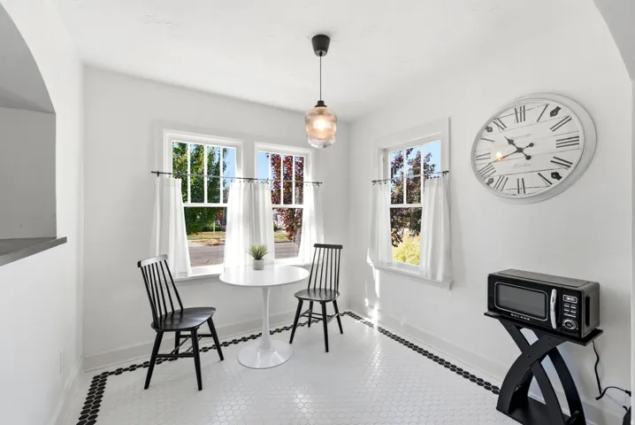 White hexagonal tile flooring with a black border