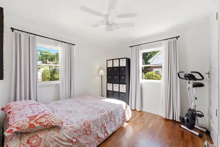 Hardwood flooring and dual windows with natural light
