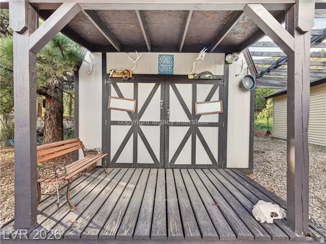 Wood-plank outdoor decking with a covered patio area