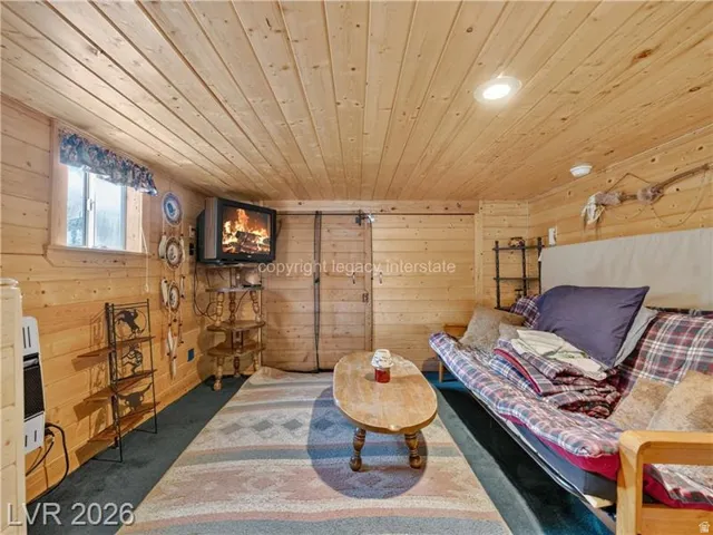 Paneled wood walls and ceiling with recessed lighting