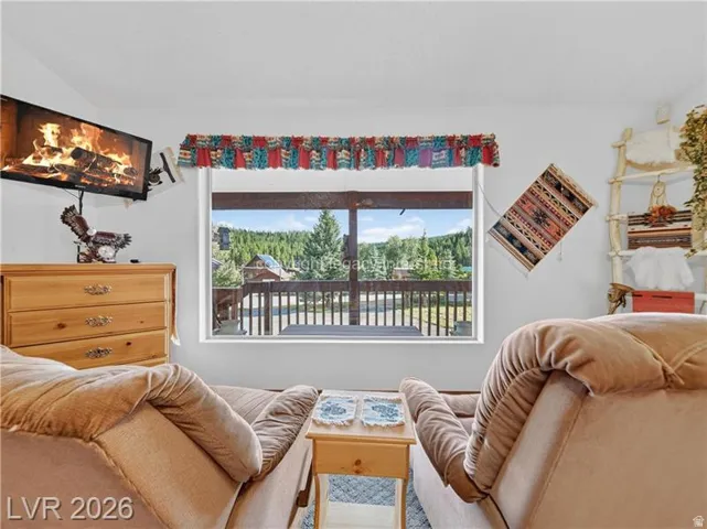 Bright interior with a large window offering expansive natural scenery