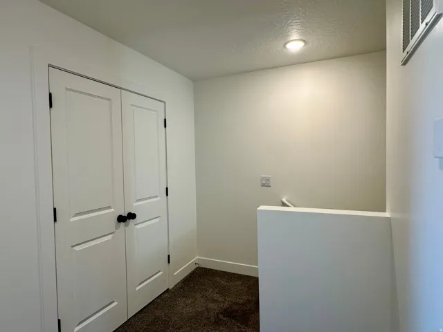 Storage closet at the top of the stairway