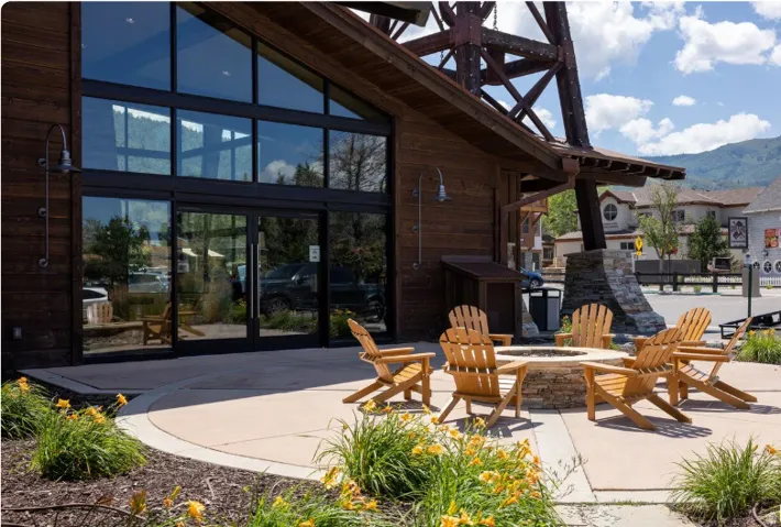 Expansive storefront windows and glass entry doors