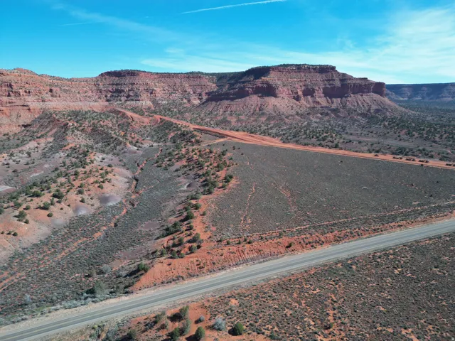 Expansive land parcel featuring desert landscaping and prominent red rock formations