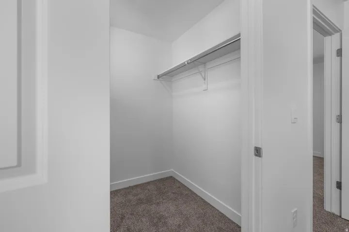Built-in closet shelving with a hanging rod