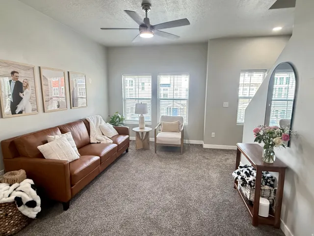 Recessed lighting, ceiling fan, and multiple windows with blinds