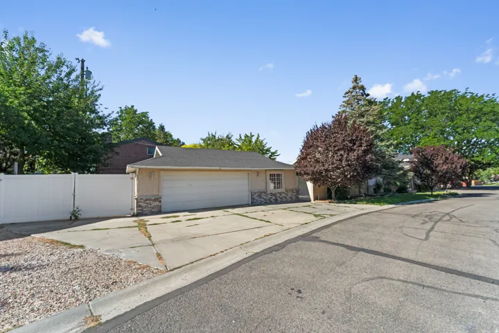 Attached two-car garage with a paved driveway