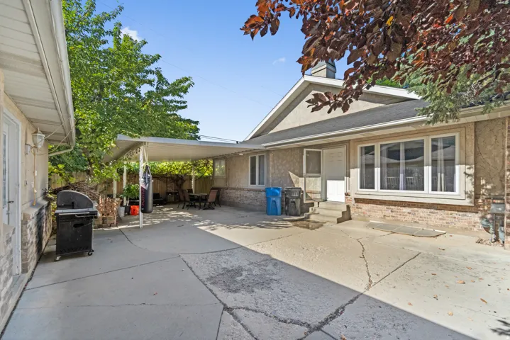 Covered patio area with concrete flooring