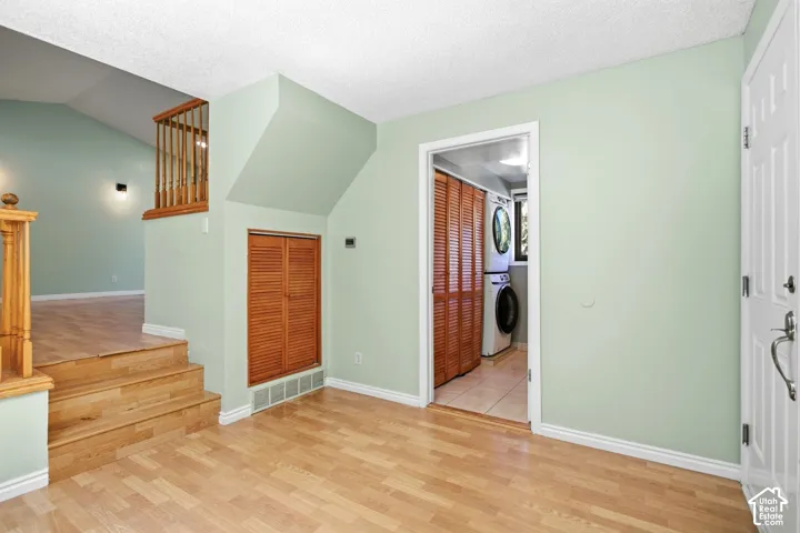 Office/flex space. Wood-finish flooring throughout, featuring a staircase with wooden railings