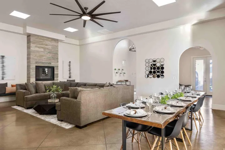 Spacious room featuring high ceilings, multiple skylights, and arched doorways