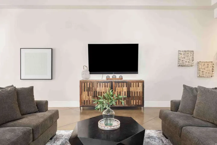 Warm-toned walls with a wood-finish console cabinet