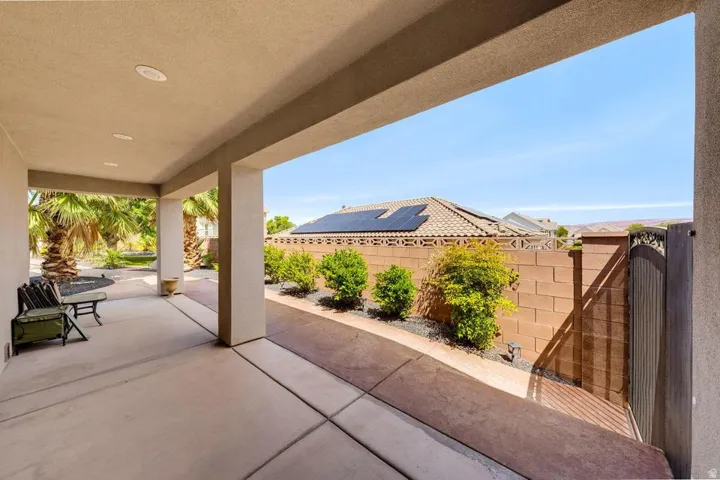 Covered patio with recessed lighting, concrete flooring, and solid stucco columns