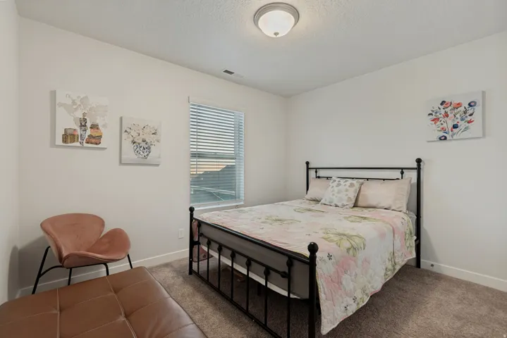 Recessed lighting, window with blinds, and neutral carpet