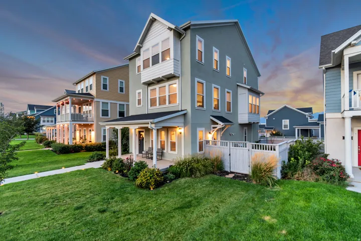 Three-story exterior with stucco and siding finishes