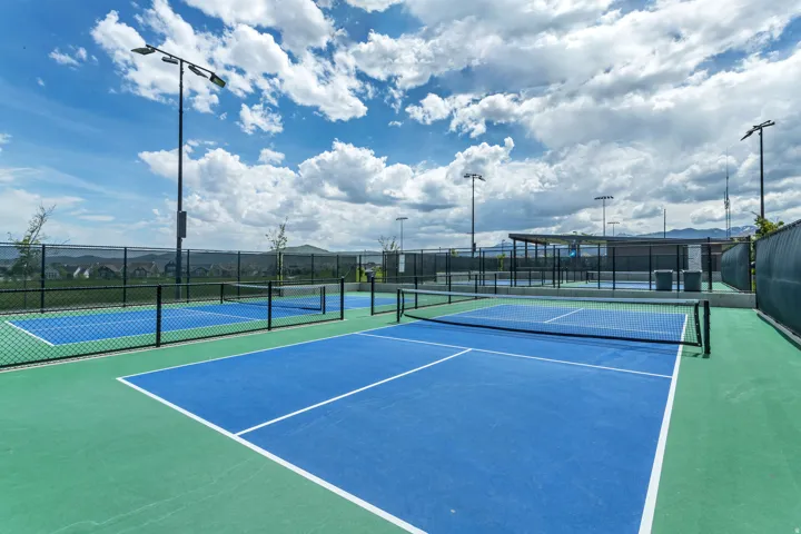 Multiple outdoor hard courts with clear line markings