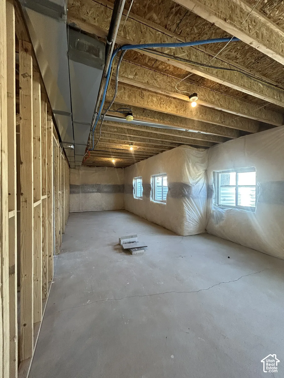 Concrete flooring with exposed ceiling joists