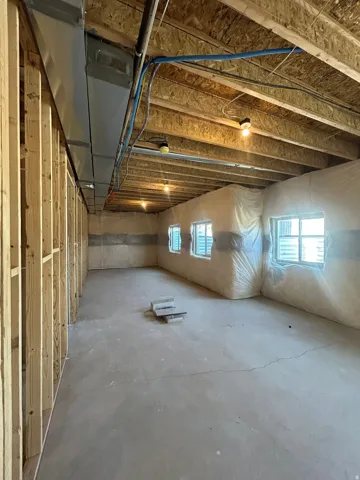 Concrete flooring with exposed ceiling joists