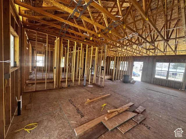 New construction framework featuring exposed wood trusses and subflooring