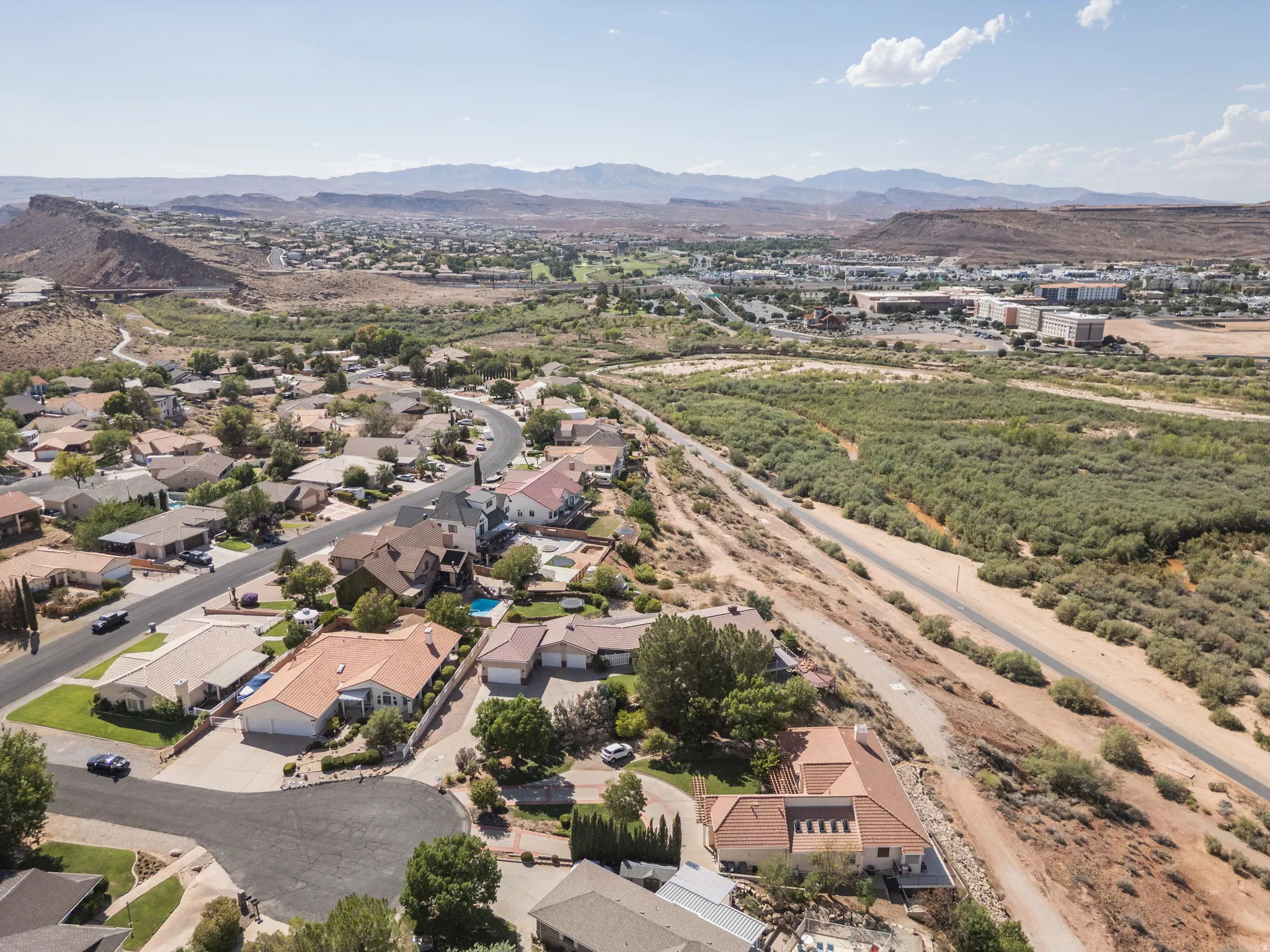 Residential area featuring varied architectural styles and mature landscaping