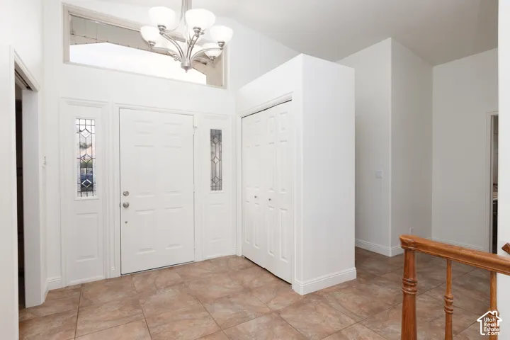 Entryway featuring a decorative transom window and sidelight panels