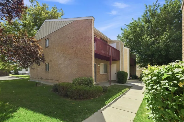 Brick and siding exterior with a second-story balcony