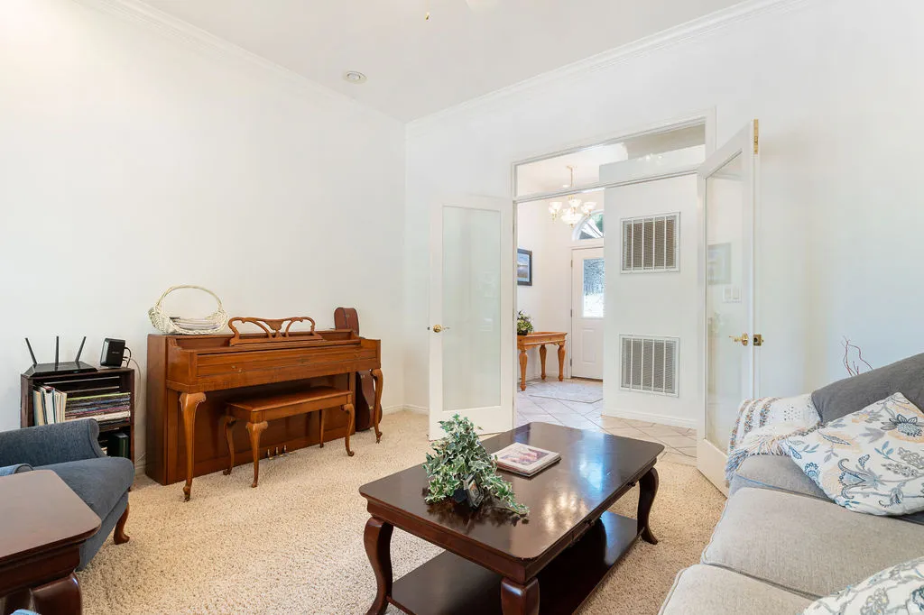 Double French doors, crown molding, and recessed lighting