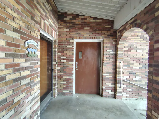 Brick exterior with an arched entryway