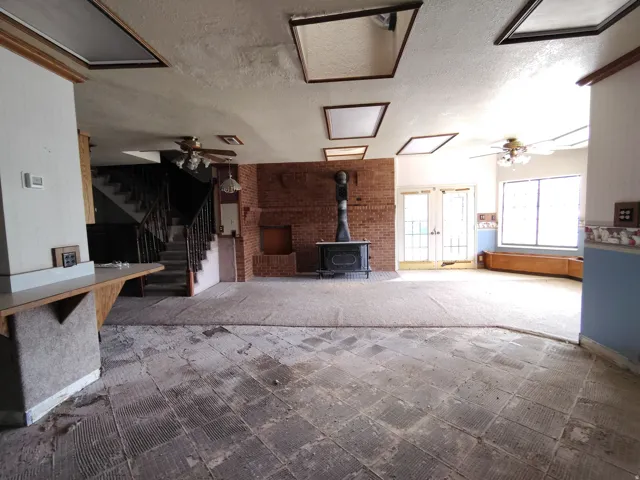 Exposed brick wall with a built-in wood-burning stove
