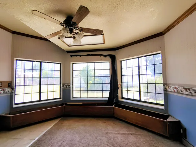 Bay window configuration with built-in planter boxes and a ceiling fan