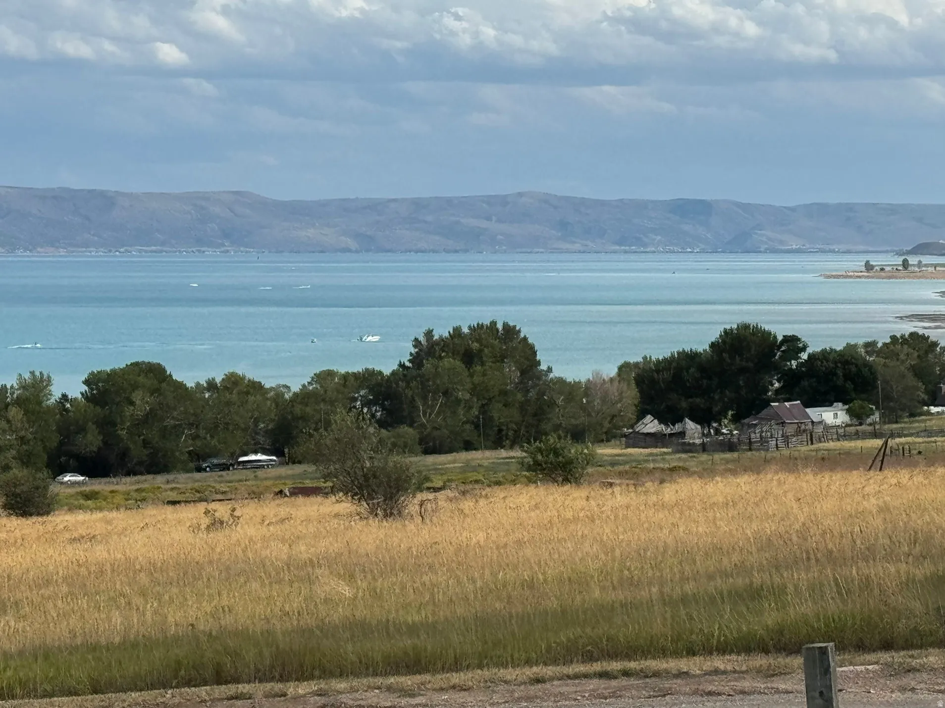 Expansive water body with surrounding mountains