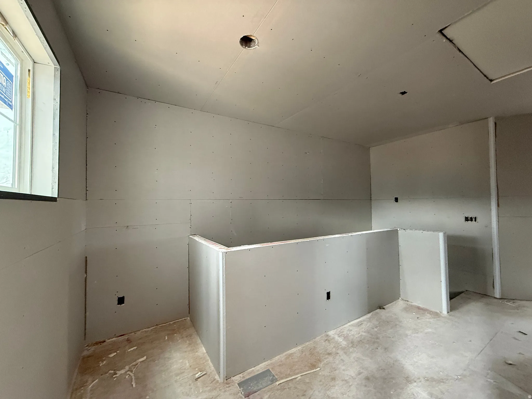 hallway featuring a pulldown attic space for storage